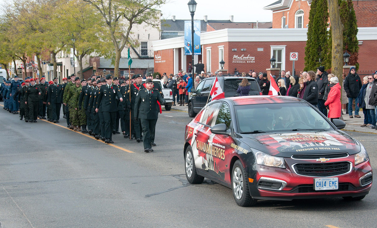 Marchers behind Canadian Heroes Car
